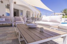 Lounge area on the outdoor terrace and the swimming pool